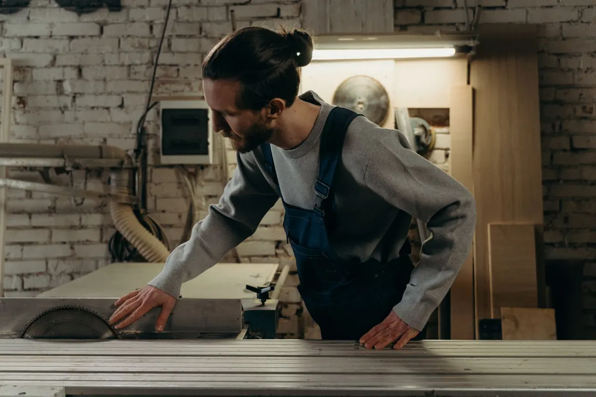 A carpenter at work in his timber workshop